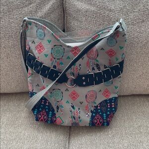 Stylish Gray and Pink Patterned bag with sewing supplies in it